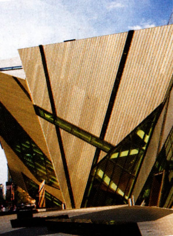 Richard Comparey modern architectural building with innovative design, featuring bold geometric shapes and extensive glass windows.
