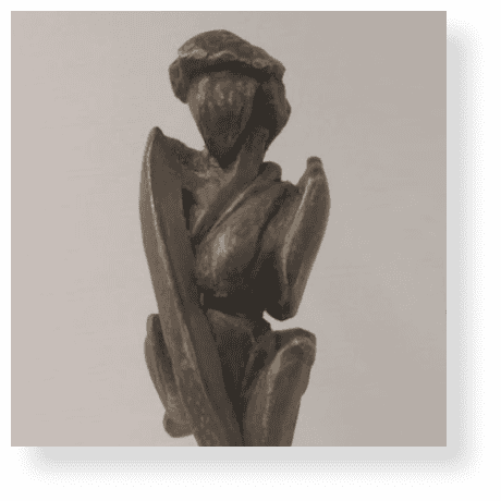 Intriguing wooden sculpture of a thoughtful woman, showcasing artistic craftsmanship and unique design by Richard Comparey.