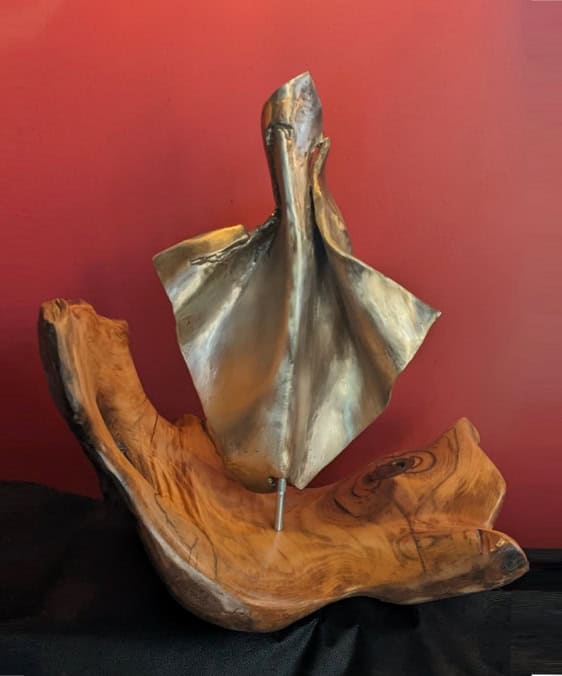 Contemporary wooden and metal abstract sculpture art piece by Richard Comparey, blending natural wood textures with modern metal elements for artistic expression.