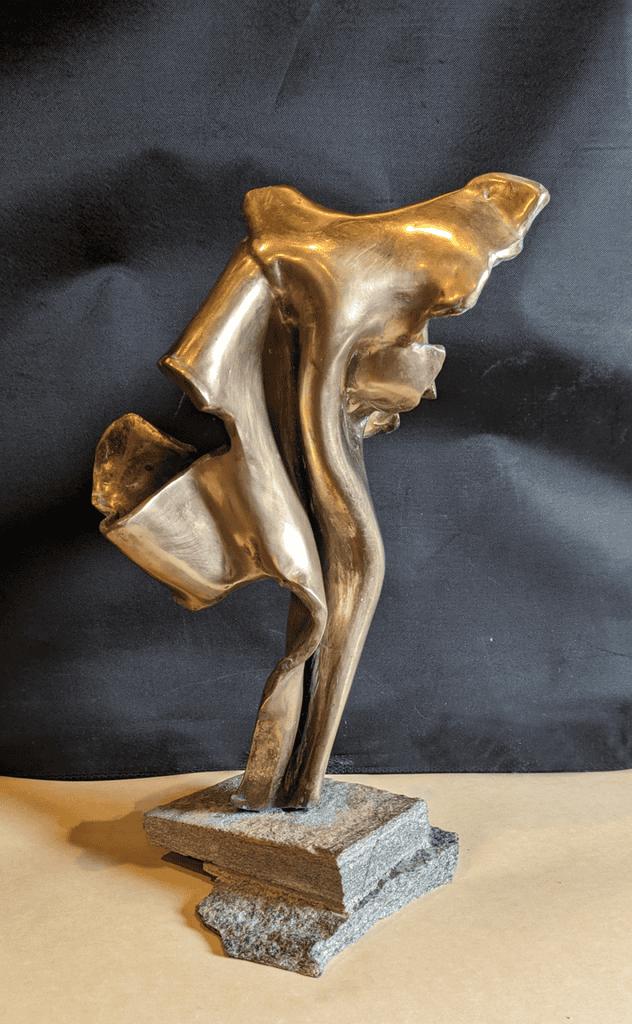 Elegant metallic abstract sculpture by Richard Comparey, showcasing modern art design and craftsmanship in a sleek, contemporary style, ideal for art collectors and interior decor.
